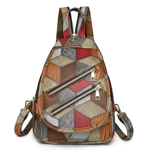 Multifunctional patchwork crossbody chest bag with textured leather and gold zippers