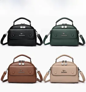 Color display of doctor style crossbody bags in black, green, brown, and khaki