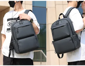 Vue détaillée d'un sac à dos d'affaires gris anthracite imperméable avec poches zippées