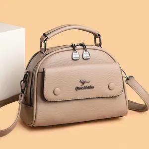 Chic beige cowhide texture doctor bag with adjustable shoulder strap and kangaroo logo