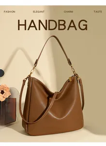 Detail of soft brown leather hobo bag with gold hardware and removable shoulder strap