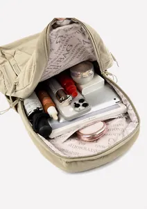 Top view of spacious khaki waterproof backpack showing large interior storage and pockets