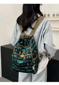 Detail of printed vintage backpack with bamboo leaf pattern and security lock feature
