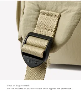 Detail of durable nylon fabric with BSTO embossed plastic buckle on beige backpack strap