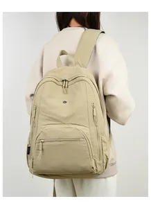 Detailed back view of a khaki waterproof backpack with ergonomic wide shoulder straps
