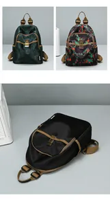 Detail of floral patterned backpack showing front buckle and durable nylon fabric texture