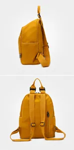 Detail view of mustard yellow backpack showing side storage and anti-theft back pocket
