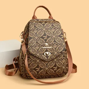 Brown leather backpack for women with vintage floral pattern and golden kangaroo lock