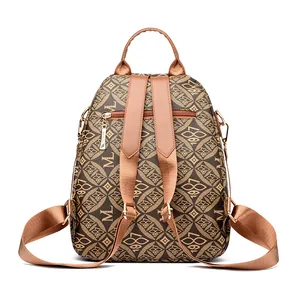 Brown vintage printed PVC backpack with geometric patterns and anti-theft back pocket