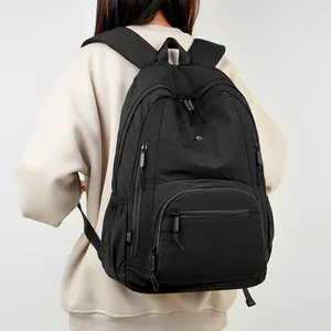 Large black waterproof outdoor backpack with multi-pocket storage for students
