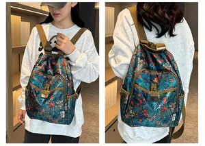 Detail view of retro floral backpack with bamboo leaves print and secure buckle pockets