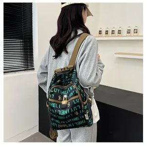 Detail view of printed backpack featuring vintage patterns and reinforced brown shoulder straps