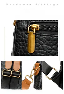 Detailed close-up of golden metal zippers and adjustable hooks on a punk style backpack