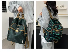 Detail of waterproof nylon backpacks with floral prints and multi-pocket structures
