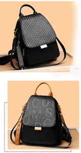 Close-up of punk rivet backpack with woven leather texture and letter embossing details