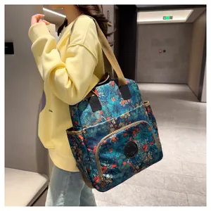 Detailed view of the large capacity backpack featuring a forest and orange fruit print