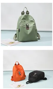 Detail view of nylon travel backpacks in dark green, bright orange, and black colors