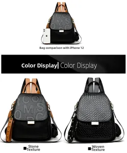 Detail view of punk rivet backpack showing woven texture and size comparison with phone