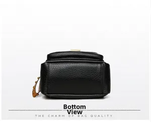 Bottom view of black textured leather backpack with gold rivet studs and side strap details