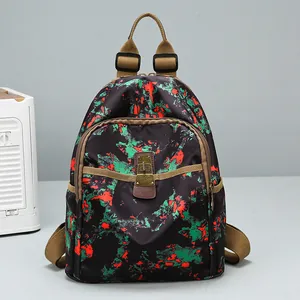 Retro black backpack with red green floral print and vintage metal lock decoration