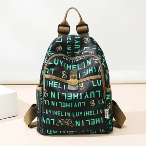 Retro black waterproof backpack with green leaf pattern and cartoon character print