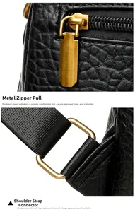 Detail of durable golden electroplated zipper pulls and strap connectors on leather bag