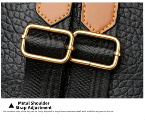 Detail of adjustable shoulder strap with gold buckles on black leather punk backpack