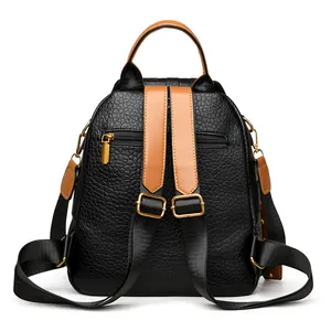 Punk style rivet backpack for women featuring lychee pattern leather and back zip pocket