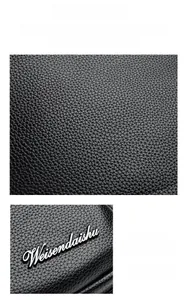 Macro detail of elephant grain leather and shiny Weisendaishu metal hardware logo