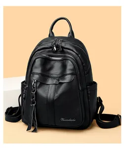 Detailed shot of litchi pattern leather backpack with metallic zippers and logo