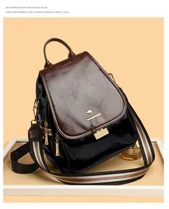 Close-up of premium leather backpack featuring colorful striped strap and golden logo