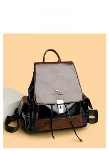 Detail of the contrast color leather backpack featuring kangaroo logo and buckle