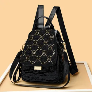 Punk style black crocodile pattern backpack with golden rivets and dual ring design