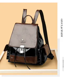 Detail of contrast stitch leather backpack with kangaroo metal buckle and drawstring closure