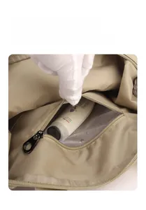 Detail of waterproof nylon backpack showing the interior dry-wet separation pocket