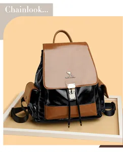 Detailed view of bicolor leather backpack with metal buckle and kangaroo logo emblem