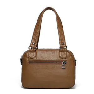 Brown washed leather tote bag with rivets and back zipper pocket in Boston style