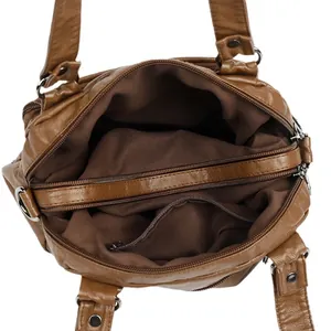 Brown leather boston bag with internal compartments, zippers and litchi texture