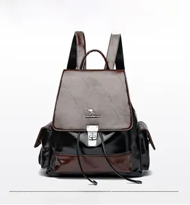 Close-up of contrast color leather backpack with drawstring and metal lock buckle