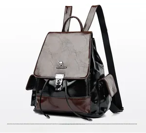 Detail of color-block wax leather backpack with drawstring closure and metal kangaroo logo