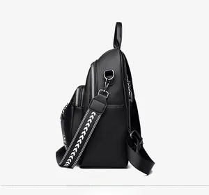 Side view of black lychee leather backpack with geometric pattern woven strap details