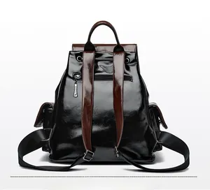 Rear view of leather backpack showing anti-theft zipper pocket and brown straps