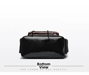 Detailed bottom view of dual-color leather backpack showing premium texture and sturdy base