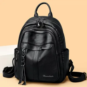 Litchi pattern black leather backpack for women with tassel zipper and silver logo