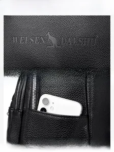 Close-up of litchi texture leather with embossed logo and functional side pocket