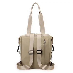 Waterproof nylon backpack in khaki with convertible tote handles and adjustable straps