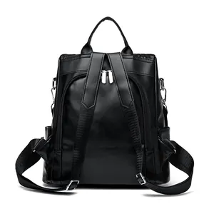 Sac à dos femme en cuir noir avec broderies florales et fermeture éclair antivol au dos