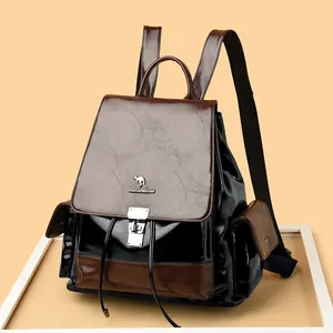 Luxury brown and black leather drawstring backpack with metallic kangaroo logo and secure lock