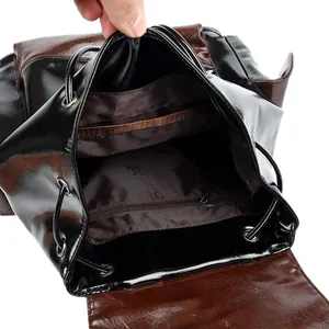 Two-tone leather drawstring backpack with spacious interior pockets and secure closure