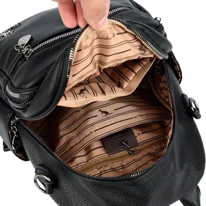 Functional black pebbled leather backpack showing spacious multi-layer interior storage